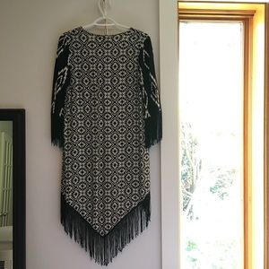 Aztec print kimono with fringed edges.
